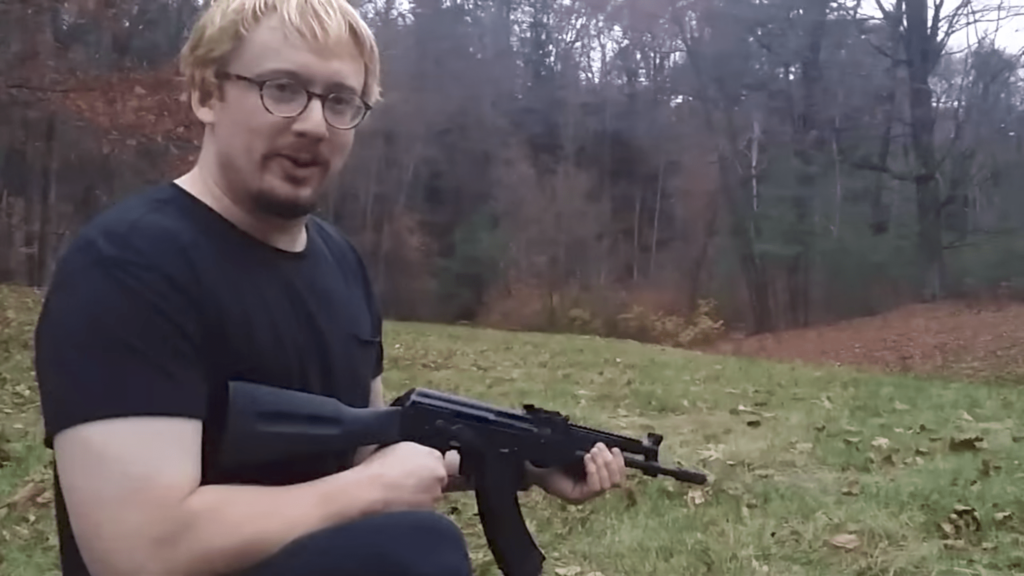 Sam Hyde wielding a gun