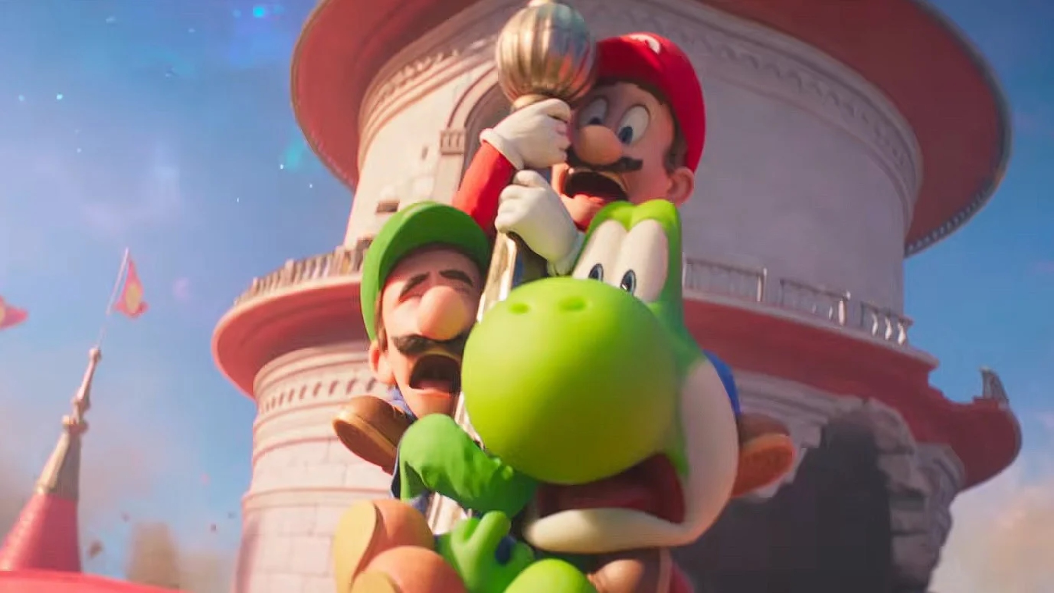 Mario Yoshi and Luigi cling onto a tower on Peachs Castle in The Super Mario Galaxy Movie trailer 1